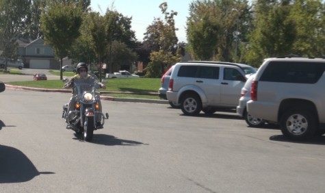 Mr. Swanson riding around on his Harley Davidson.