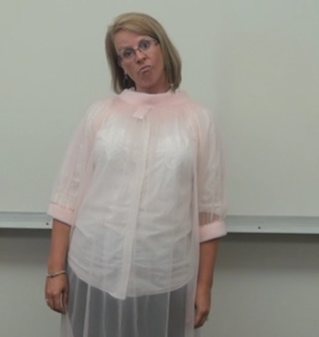 doing a sarcastic smirk, Andra tries not to laugh as D-TV shoot for a description of the dress code. This was filmed for the September 23 broadcast.