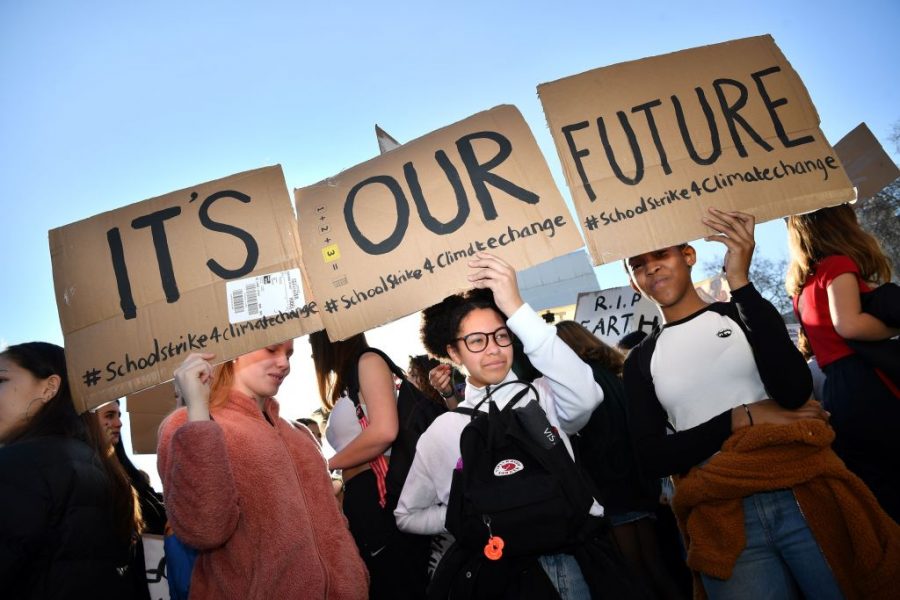 Young+demonstrators+hold+placards+as+they+attend+a+climate+change+protest+organised+by+Youth+Strike+4+Climate%2C+opposite+the+Houses+of+Parliament+in+central+London+on+February+15%2C+2019.+-+Hundreds+of+young+people+took+to+the+streets+to+demonstrate+Friday%2C+with+some+of+them+having+gone+on+strike+from+school%2C+as+part+of+a+global+youth+action+over+climate+change.+%28Photo+by+Ben+STANSALL+%2F+AFP%29++++++++%28Photo+credit+should+read+BEN+STANSALL%2FAFP%2FGetty+Images%29