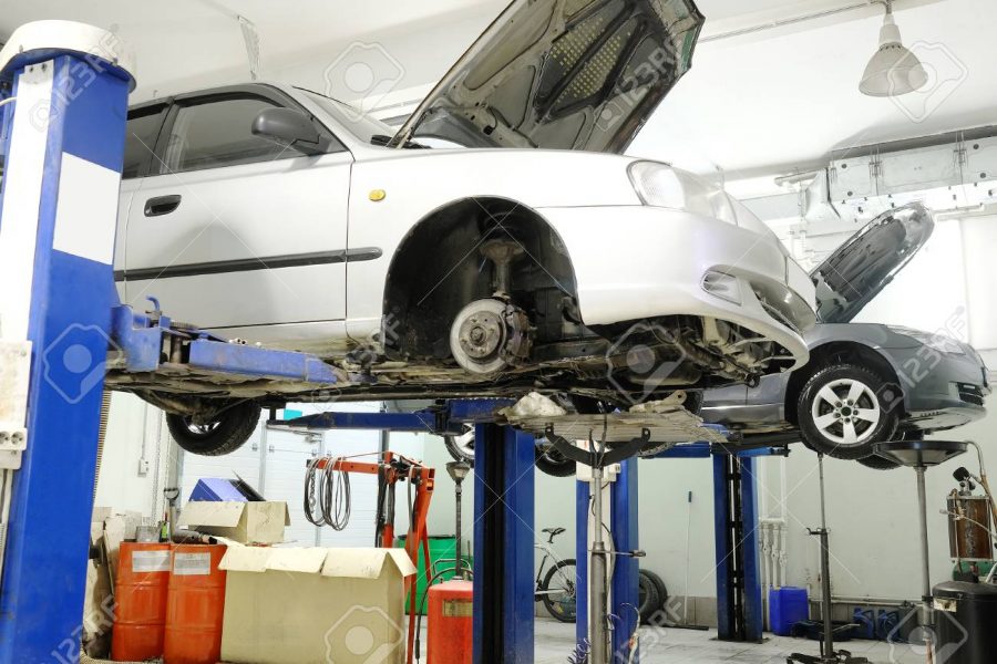 Car on a lift in a car repair station