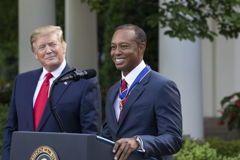 Tiger Woods is presented with the Medal of Freedom by former President Donald Trump
