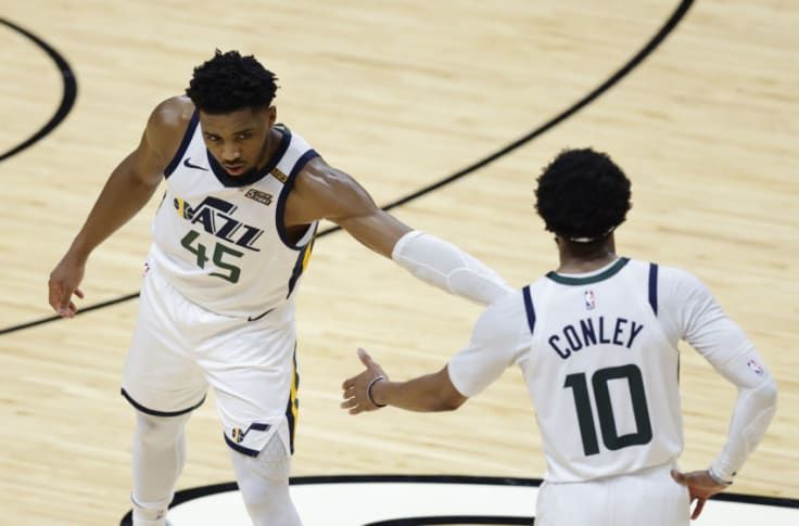 Donovan Mitchell (45) and Mike Conley (10) high five.